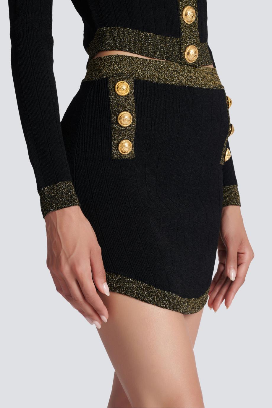Short knit skirt with gold trim