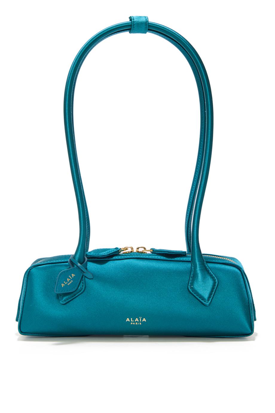 Le Teckel satin clutch in emerald