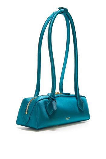 Le Teckel satin clutch in emerald