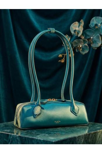 Le Teckel leather shoulder bag in blue paon
